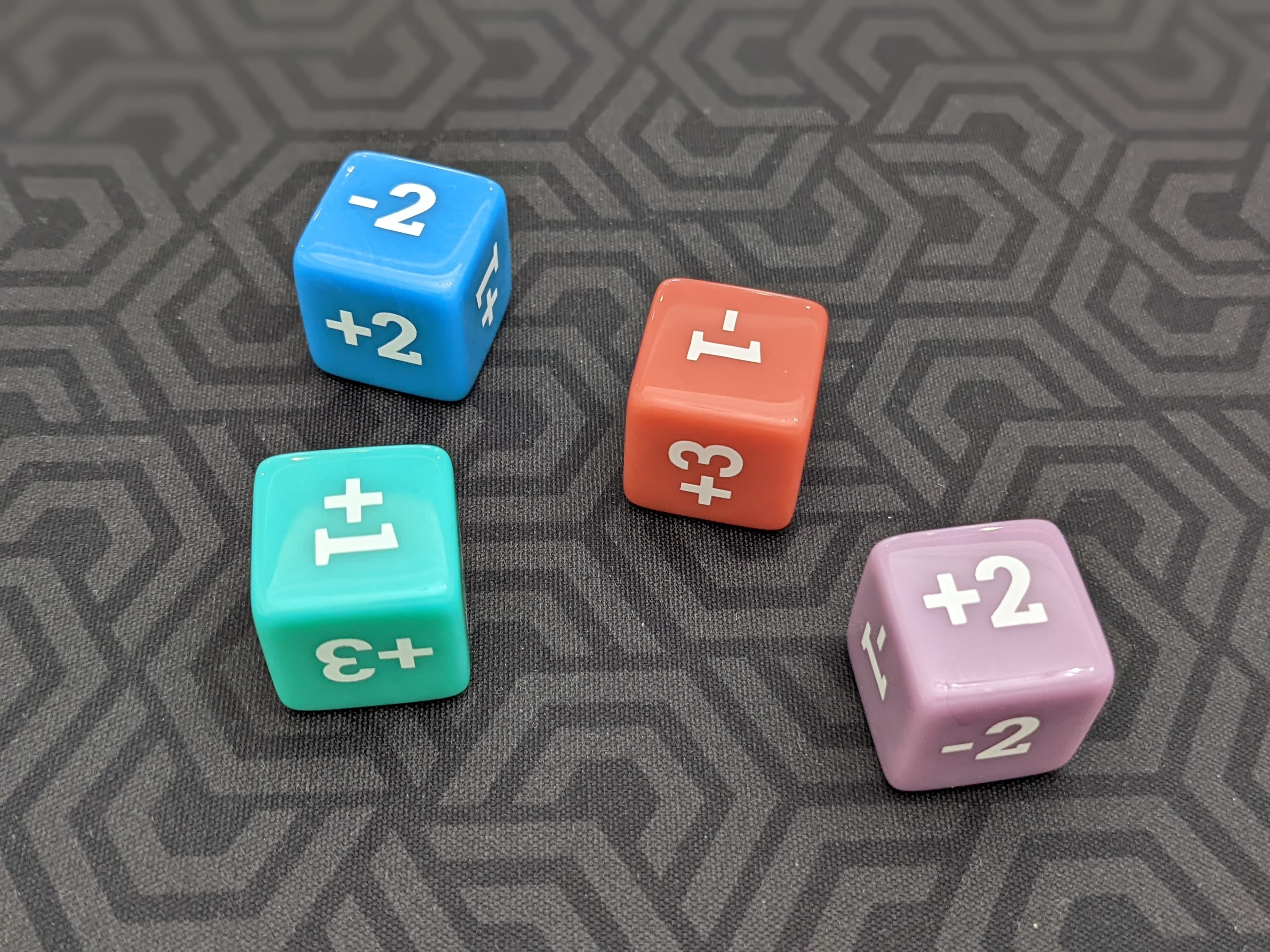 Four custom-molded market volatility dice