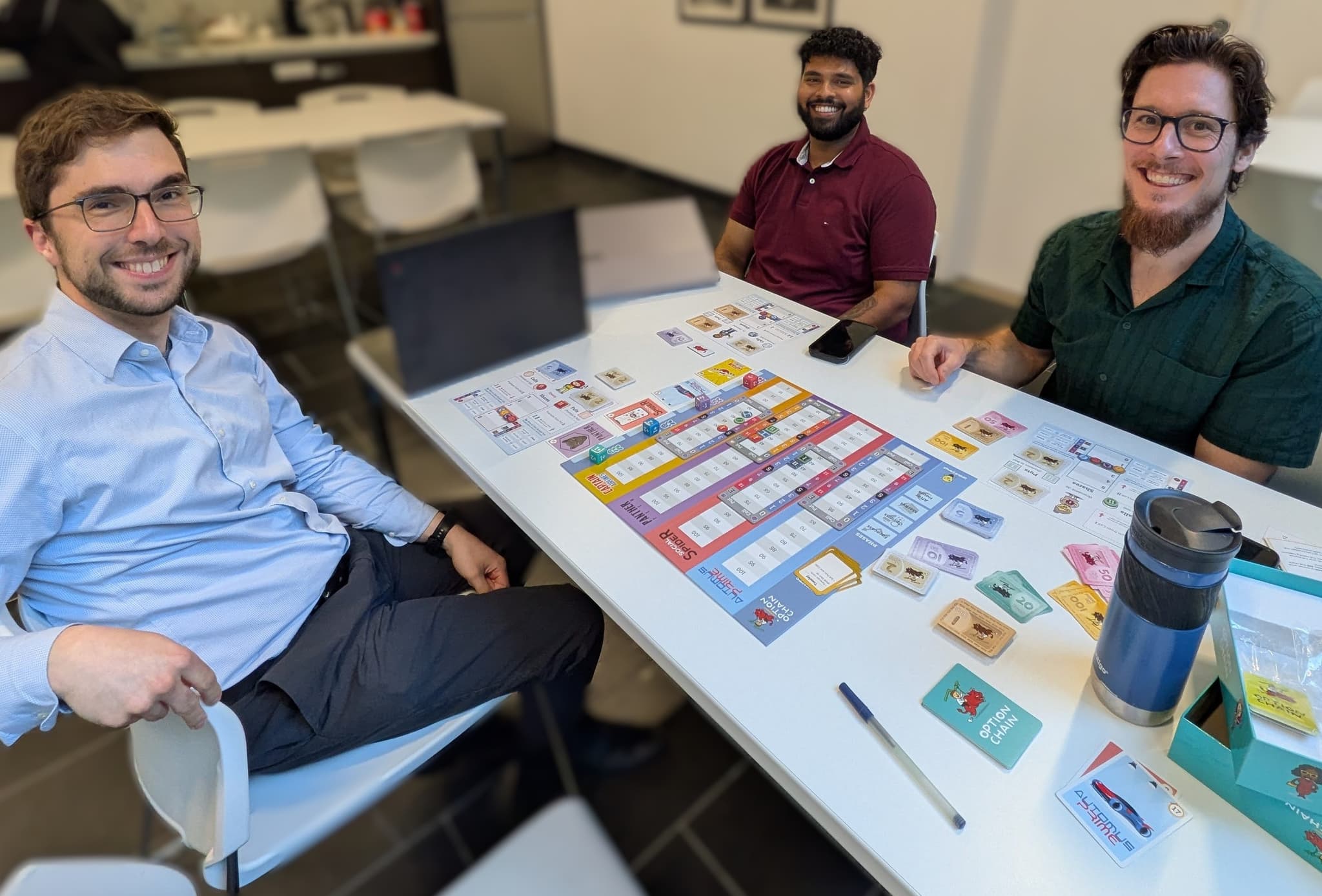Friends and colleagues playing Option Chain around the table